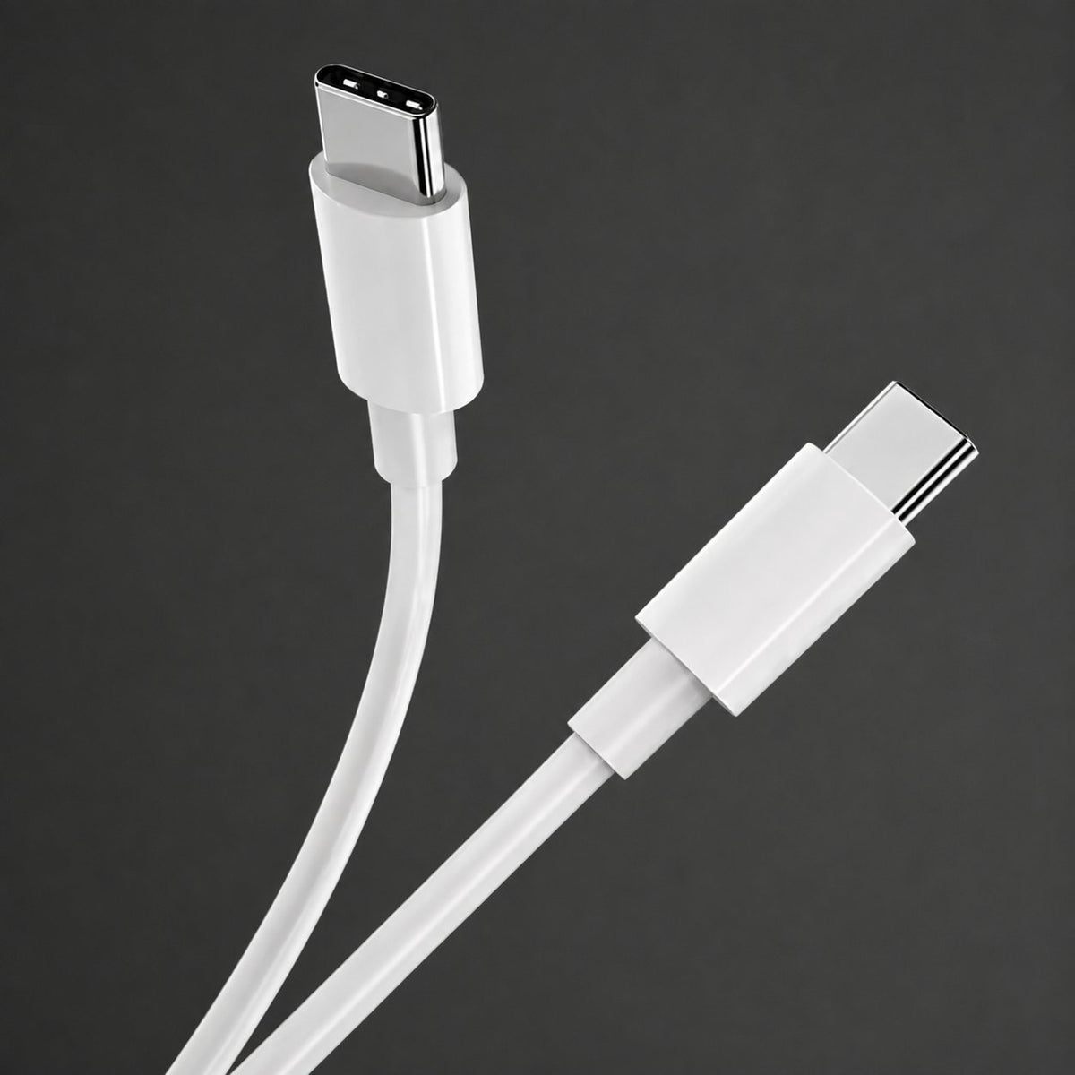 White USB-C cable connector close-up on charcoal
