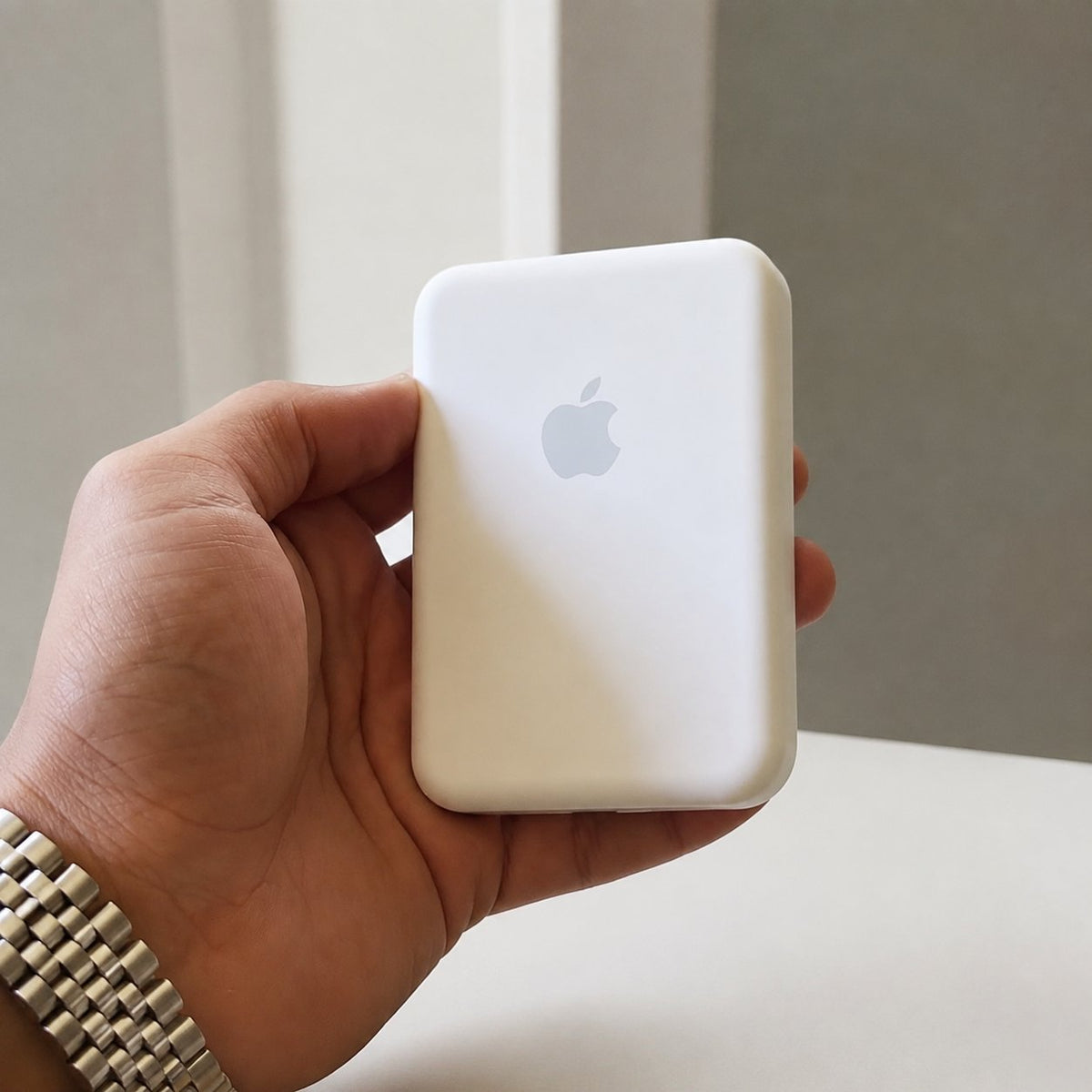 Handheld front view of the white magnetic power bank