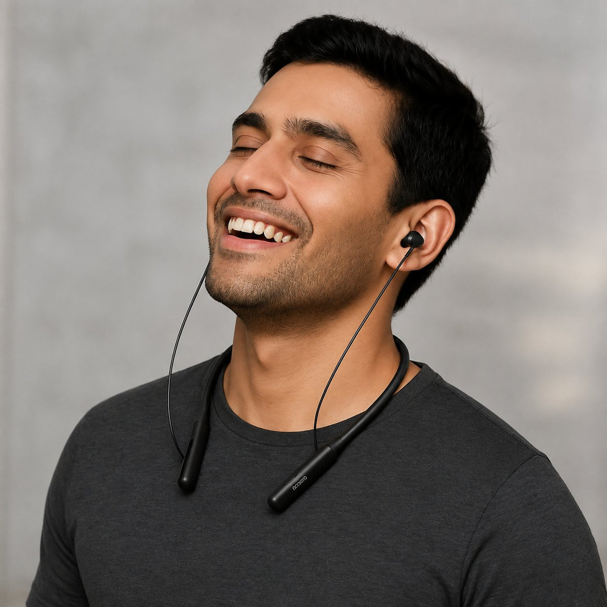 Adult wearing black wireless neckband earphones