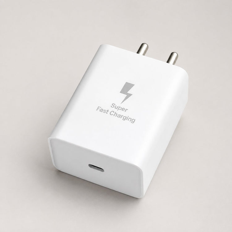 White 25W USB-C adapter showing its output port on a warm grey surface