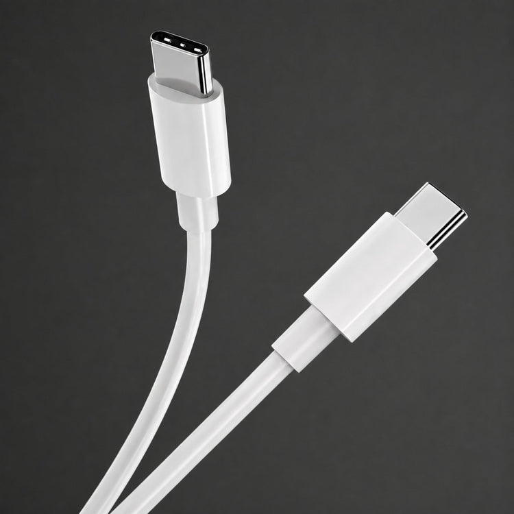 White USB-C cable connector close-up on charcoal