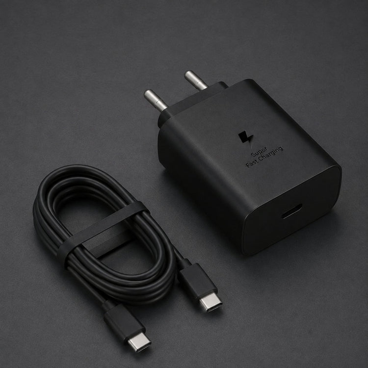 Black 45W charger with a coiled USB-C to USB-C cable on charcoal