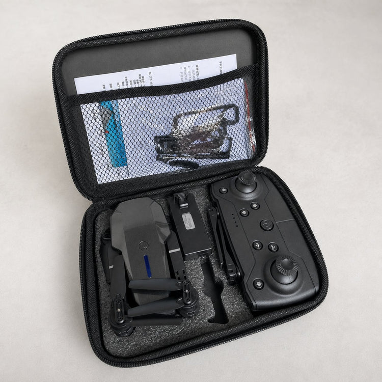 Folded drone and controller in open carrying case