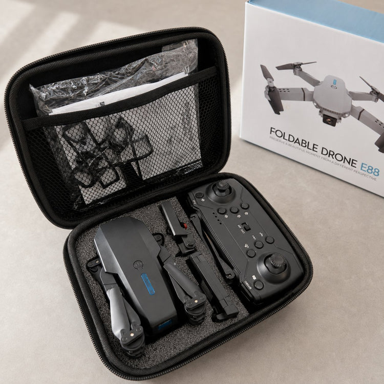 Open drone kit beside its retail box