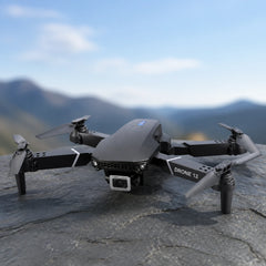 Black drone resting on a slate surface