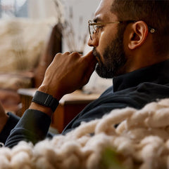 Black WHOOP fitness tracker worn on a wrist in an everyday setting
